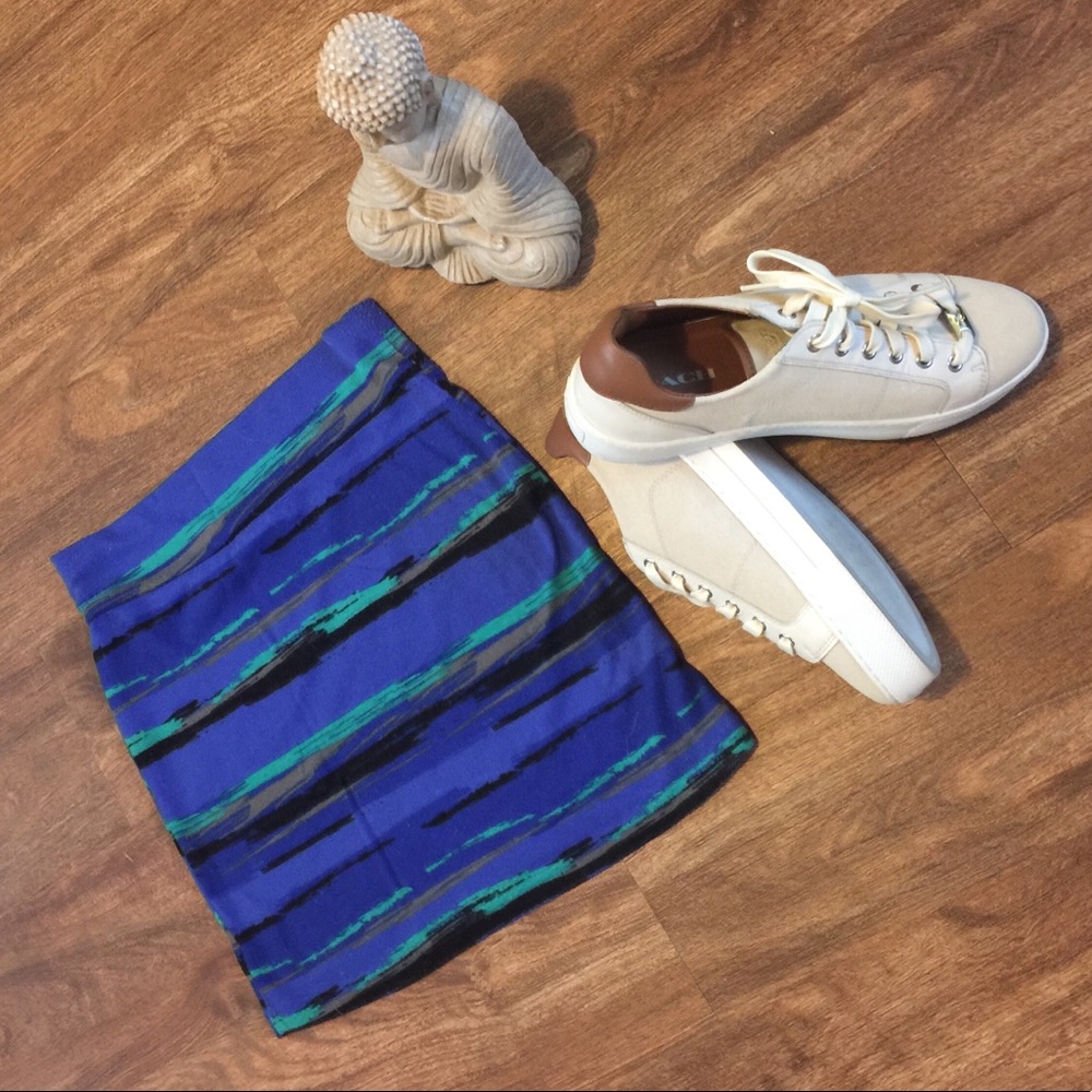 Blue, green, black and tan mini skirt.